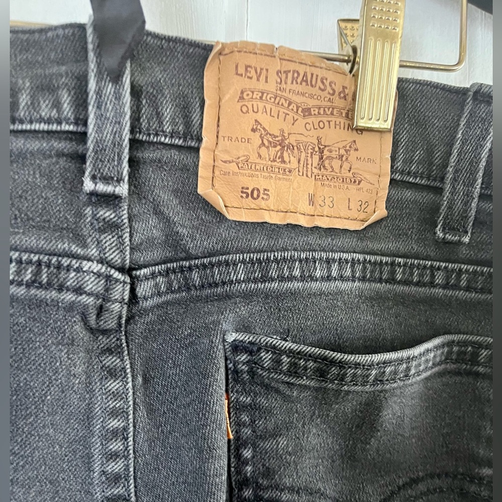faded black Levi’s 505